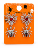 A pair of silver-toned spider and web drop earrings with red heart and rhinestone details, displayed on an orange Halloween-themed backing card labeled Taramarda.