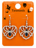 Silver spider drop earrings with dark blue oval gemstones, displayed on an orange Halloween-themed card labeled 'Taramanda'.