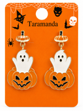 A pair of Halloween-themed dangle earrings displayed on an orange backing card. Each earring features a white ghost sitting on top of a carved orange pumpkin with black facial details.