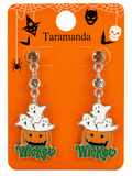 A pair of Halloween-themed dangle earrings displayed on an orange backing card. The earrings feature white ghosts sitting in orange jack-o'-lantern buckets with green 'Wicked' lettering at the bottom, suspended from clear rhinestone-studded chains.