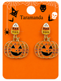 A pair of Halloween-themed dangle earrings displayed on an orange card. The earrings feature a candy corn charm with white, orange, and yellow sections, and pumpkin charms outlined in gold with multicolor rhinestones and black jack-o'-lantern faces.
