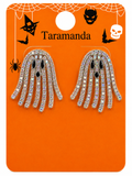 A pair of ghost-shaped rhinestone earrings on an orange Halloween-themed display card with the brand name 'Taramanda' printed at the top.