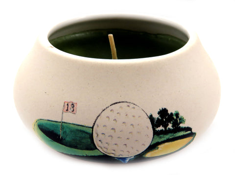 Off white ornamental ceramic candle with a golf ball and course design CNDL18