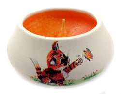 Off white ornamental ceramic candle with a cat swatting a butterfly design CNDL29